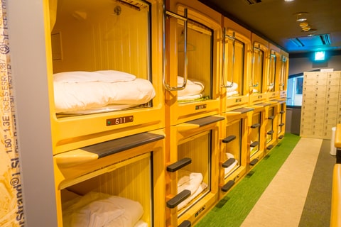 The Capsule Hotel Interior View in Japan Japan Youth Travel showcased a perfect blend of comfort and space-saving design.